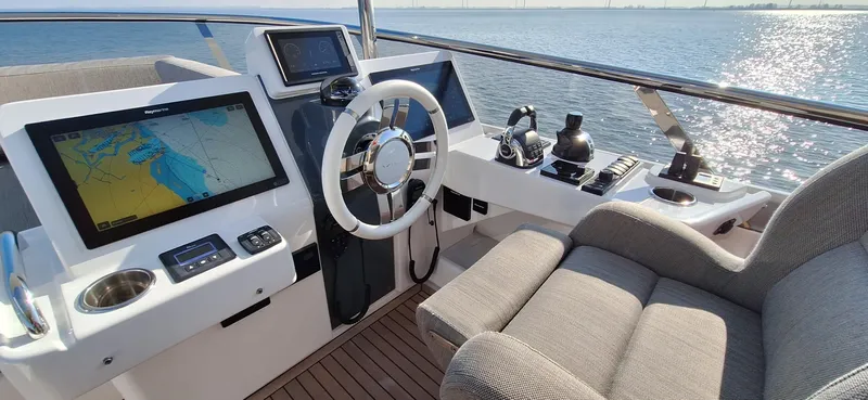 Bella Vita Yacht Photos Pics Helm of 2020 Azimut Magellano 66 yacht with navigation screens and controls.
