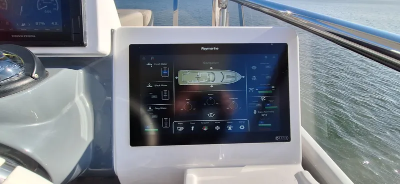 Bella Vita Yacht Photos Pics Touchscreen control panel on 2020 Azimut Magellano 66 yacht, displaying navigation and system settings.