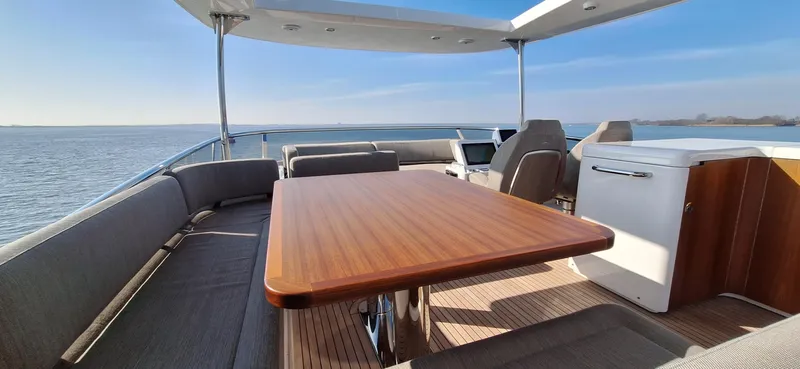 Bella Vita Yacht Photos Pics Luxurious Azimut Magellano 66 yacht deck with seating and ocean view, 2020 model.