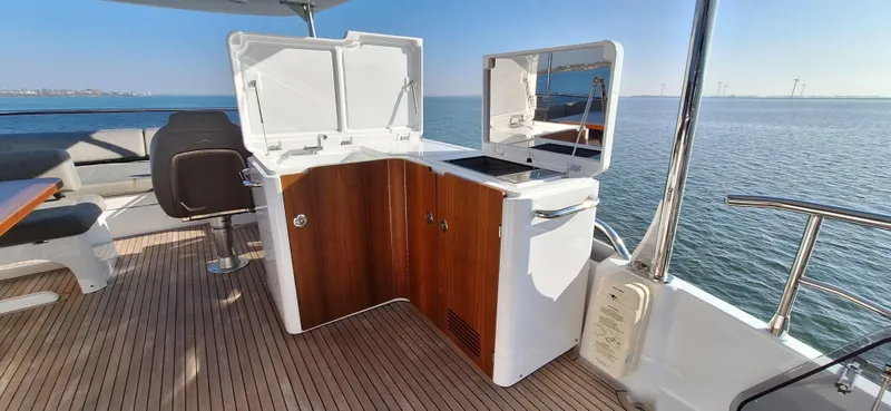 Bella Vita Yacht Photos Pics Outdoor kitchen on 2020 Azimut Magellano 66 yacht with ocean view.