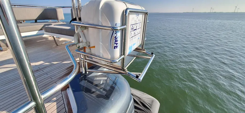 Bella Vita Yacht Photos Pics Azimut Magellano 66 yacht deck with safety equipment, 2020 model, overlooking calm sea.