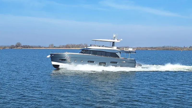 Bella Vita Yacht Photos Pics Azimut Magellano 66 yacht cruising on open water, 2020 model.