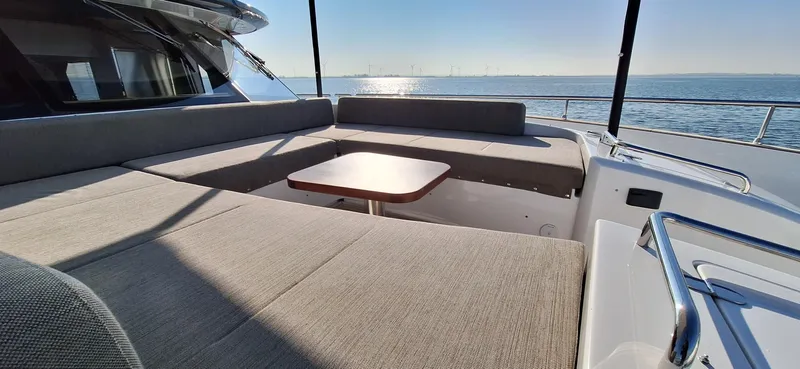 Bella Vita Yacht Photos Pics Luxurious seating area on 2020 Azimut Magellano 66 yacht with ocean view.