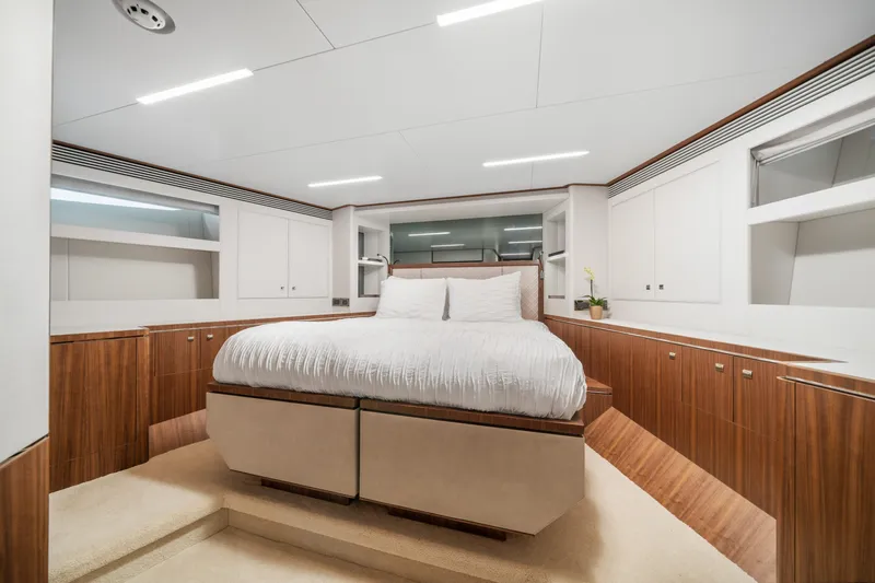 Rio Yacht Photos Pics Luxurious bedroom interior of 2023 Horizon FD90 yacht with modern design and wood accents.