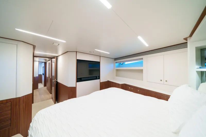 Rio Yacht Photos Pics Luxurious interior of 2023 Horizon FD90 yacht bedroom with modern design and wood accents.