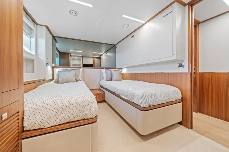 Rio Yacht Photos Pics Luxurious twin bedroom in 2023 Horizon FD90 yacht with modern wood accents.