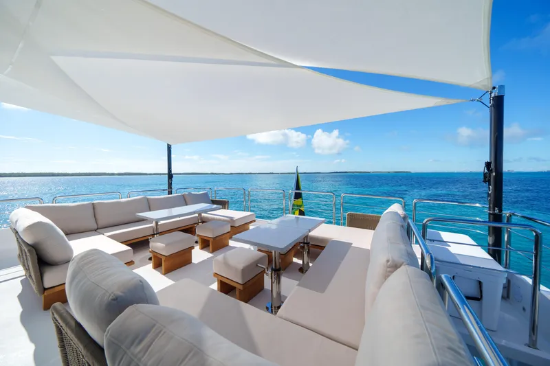 Rio Yacht Photos Pics Luxurious Horizon FD90 yacht deck with comfortable seating, ocean view, and sunshade, 2023 model.