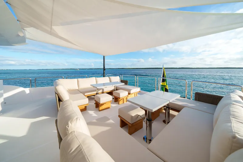 Rio Yacht Photos Pics Luxurious 2023 Horizon FD90 yacht deck with elegant seating and ocean view.