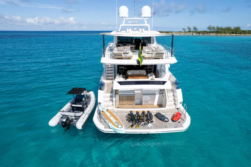 Rio Yacht Photos Pics Luxurious Horizon FD90 yacht in turquoise waters, equipped with water sports gear, 2023 model.
