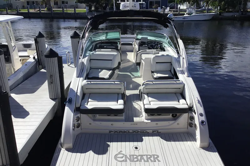 Enbarr Yacht Photos Pics 2017 Regal 3200 Bowrider docked, featuring spacious seating and sleek design.