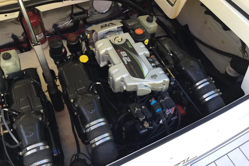 Enbarr Yacht Photos Pics Engine compartment of a 2017 Regal 3200 Bowrider boat, showcasing dual engines.