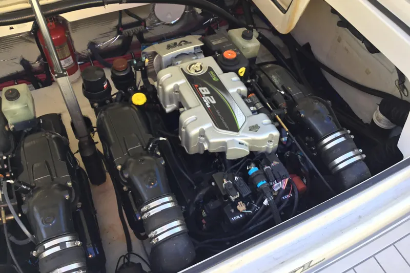 Enbarr Yacht Photos Pics Engine compartment of a 2017 Regal 3200 Bowrider boat, showcasing dual engines.