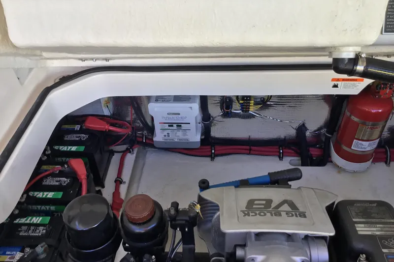 Enbarr Yacht Photos Pics Engine compartment of a 2017 Regal 3200 Bowrider with batteries and fire extinguisher.