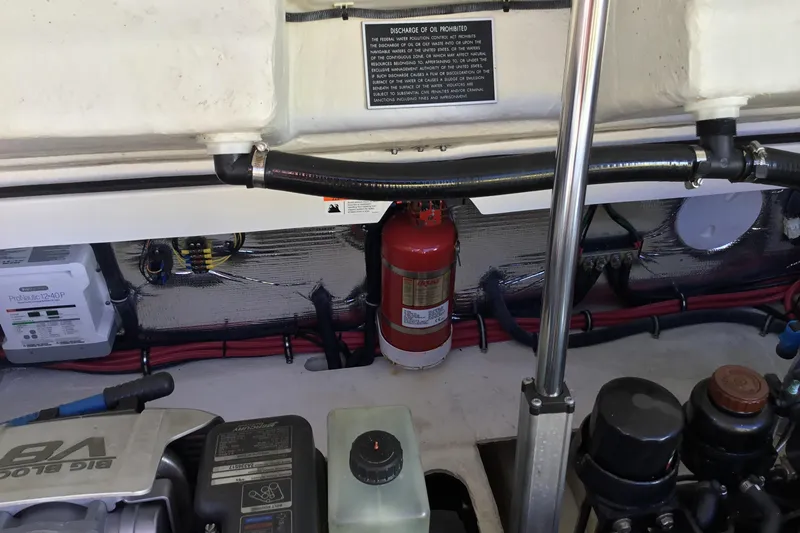 Enbarr Yacht Photos Pics Engine compartment of a 2017 Regal 3200 Bowrider with visible fire extinguisher and wiring.