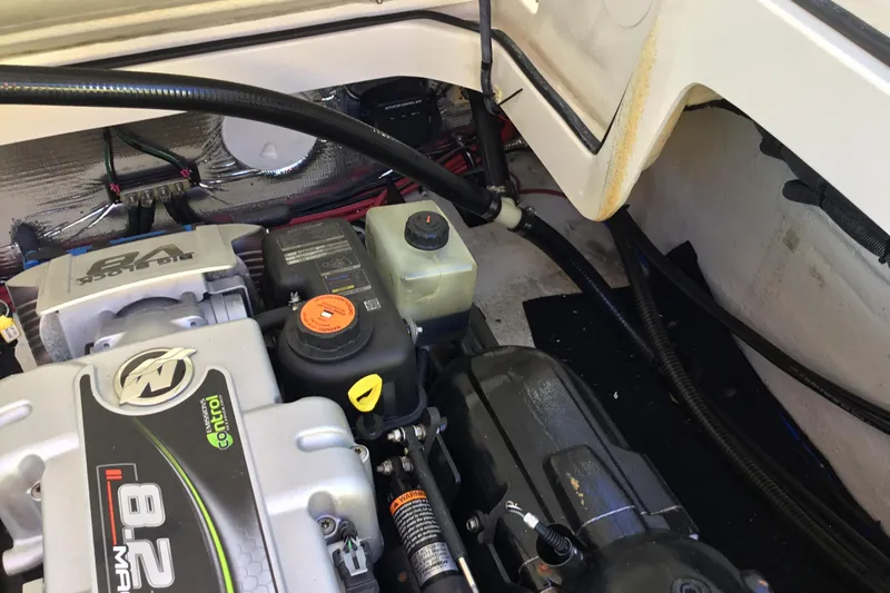 Enbarr Yacht Photos Pics Engine compartment of a 2017 Regal 3200 Bowrider, showcasing mechanical components and wiring.