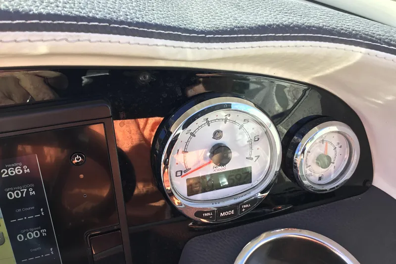 Enbarr Yacht Photos Pics Dashboard of a 2017 Regal 3200 Bowrider boat with gauges and controls.