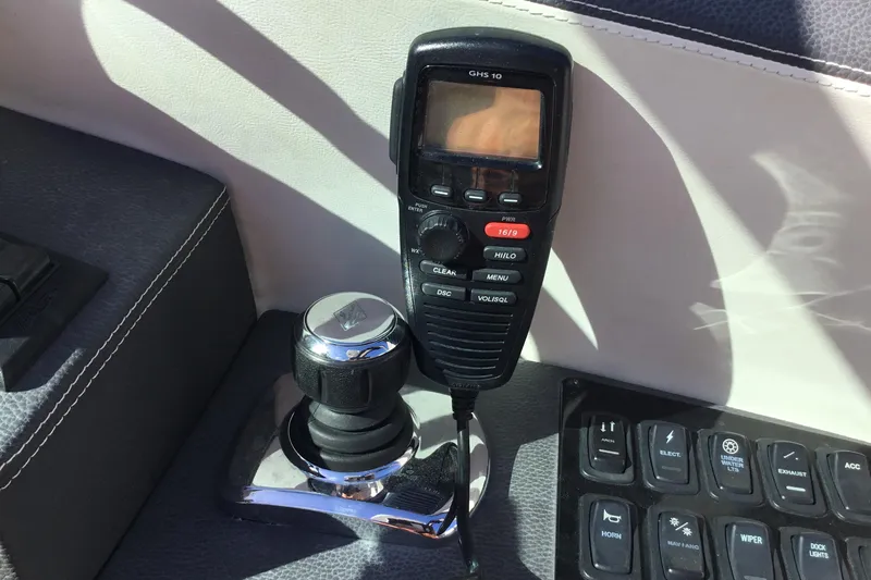 Enbarr Yacht Photos Pics Control panel of a 2017 Regal 3200 Bowrider with radio and joystick.