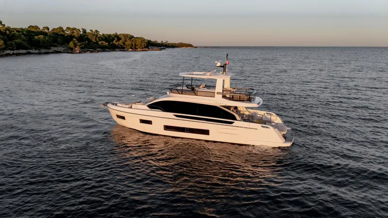  Yacht Photos Pics Azimut Fly 62 yacht, 2025 model, cruising on serene waters at sunset.