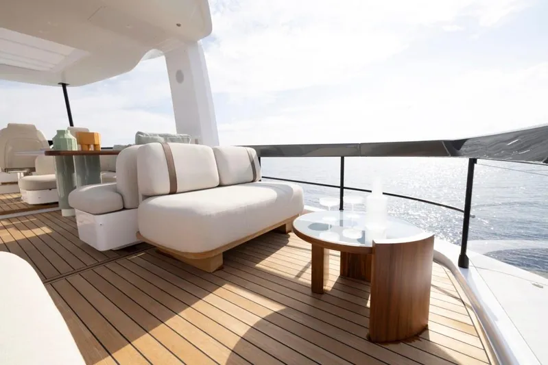  Yacht Photos Pics Luxurious deck of 2025 Azimut Fly 62 yacht with elegant seating and ocean view.