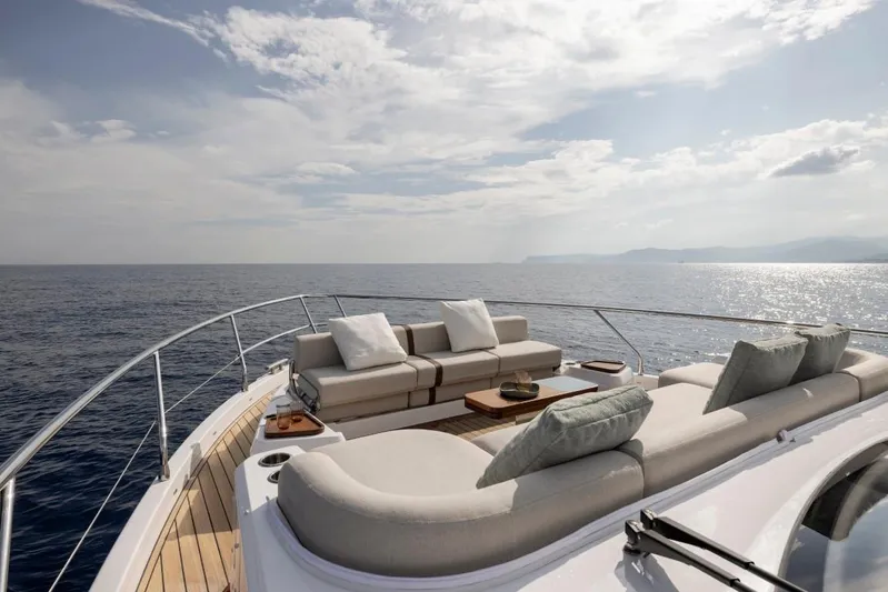  Yacht Photos Pics Luxurious Azimut Fly 62 yacht deck with elegant seating, overlooking serene ocean waters, 2025 model.