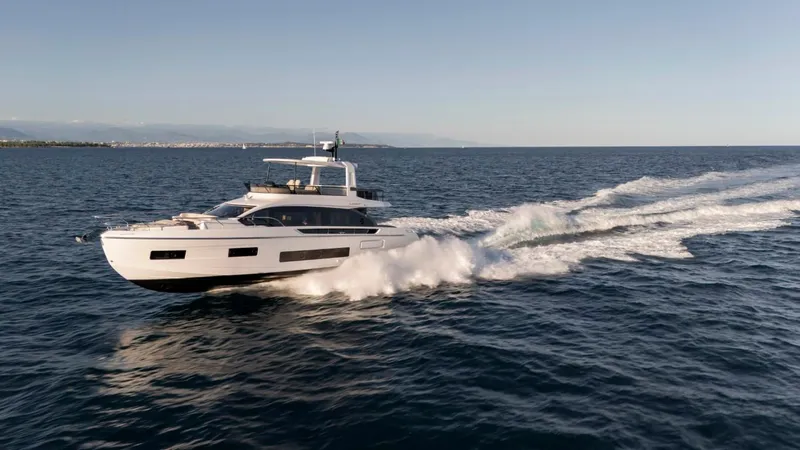  Yacht Photos Pics 2025 Azimut Fly 62 yacht cruising on open sea, creating waves.