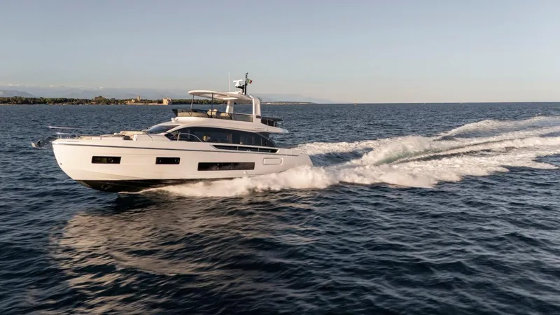  Yacht Photos Pics 2025 Azimut Fly 62 yacht cruising on open water, showcasing sleek design and performance.