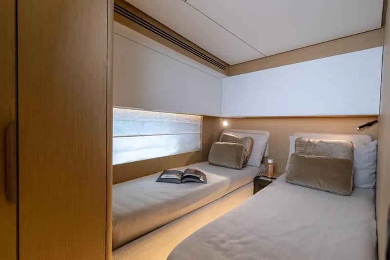  Yacht Photos Pics Luxurious twin cabin interior on 2025 Azimut Fly 62 yacht, featuring modern design and cozy bedding.