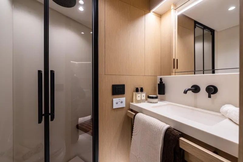  Yacht Photos Pics Luxurious bathroom in 2025 Azimut Fly 62 yacht, featuring modern fixtures and elegant design.