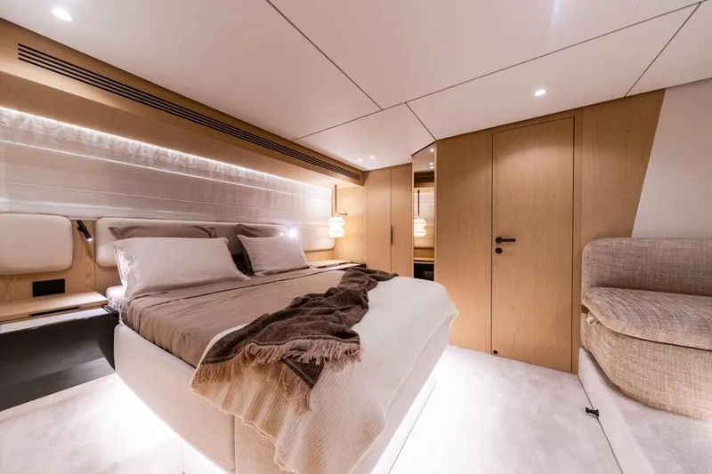  Yacht Photos Pics Luxurious bedroom interior of 2025 Azimut Fly 62 yacht with modern design and cozy ambiance.