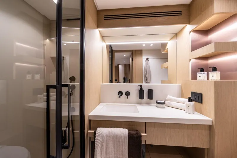 Yacht Photos Pics Luxurious bathroom interior of 2025 Azimut Fly 62 yacht, featuring modern fixtures and elegant design.