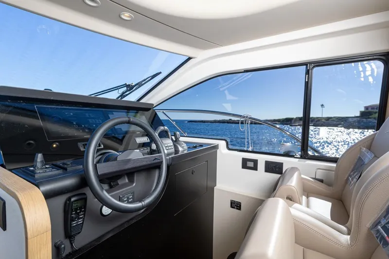  Yacht Photos Pics 2025 Azimut Fly 62 yacht interior with modern helm and ocean view.