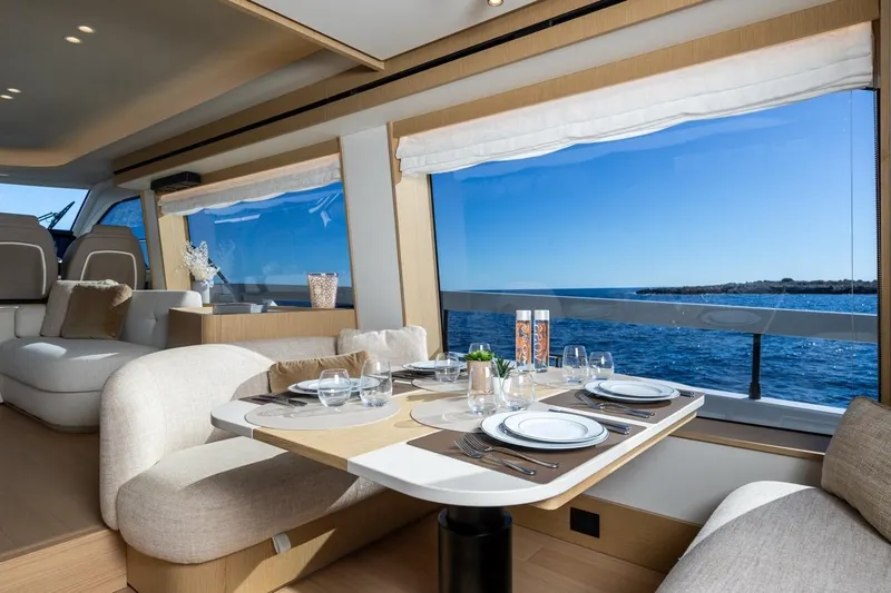  Yacht Photos Pics Luxurious interior of 2025 Azimut Fly 62 yacht with ocean view dining area.