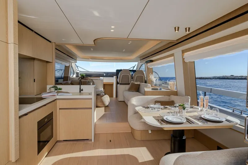  Yacht Photos Pics Luxurious interior of 2025 Azimut Fly 62 yacht with elegant dining and seating area.