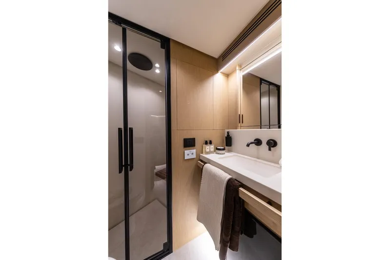  Yacht Photos Pics Luxurious bathroom in 2025 Azimut Fly 62 yacht, featuring modern fixtures and elegant design.