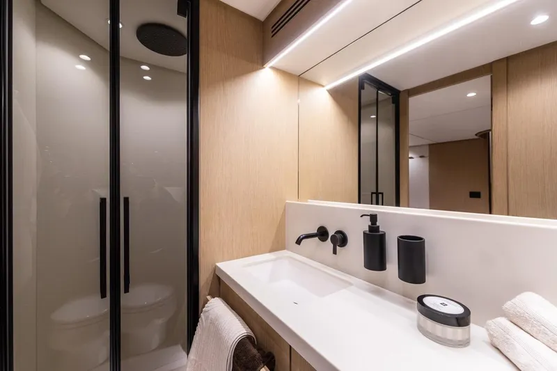  Yacht Photos Pics Luxurious bathroom interior of 2025 Azimut Fly 62 yacht with modern fixtures.