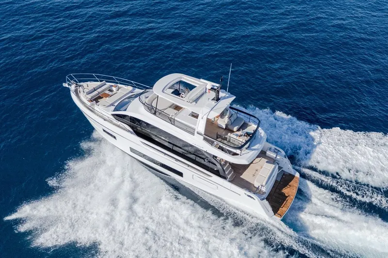  Yacht Photos Pics 2025 Azimut Fly 62 yacht cruising on open blue sea.