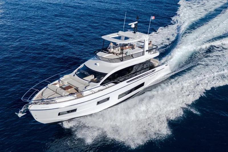  Yacht Photos Pics 2025 Azimut Fly 62 yacht cruising on open blue sea.