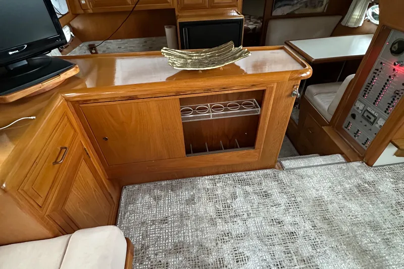  Yacht Photos Pics Interior of 1988 Ocean Alexander 42 aft cabin with wooden cabinetry and modern decor.