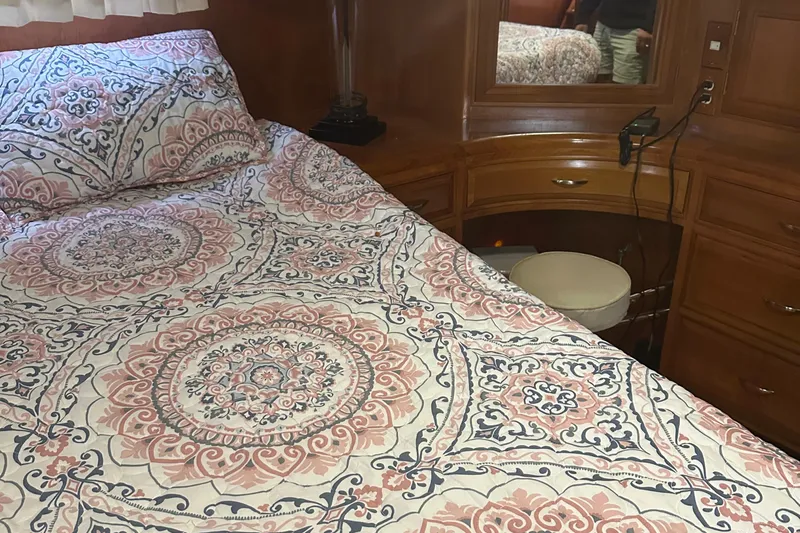  Yacht Photos Pics Cozy bedroom in 1988 Ocean Alexander 42 aft cabin yacht with patterned bedding.