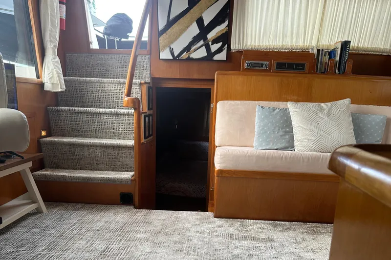  Yacht Photos Pics Interior of 1988 Ocean Alexander 42 aft cabin with stairs, sofa, and modern decor.