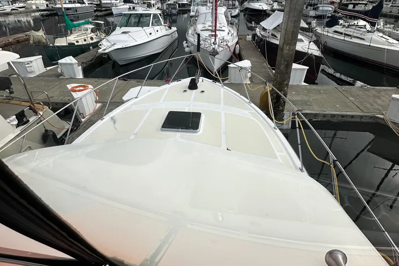  Yacht Photos Pics 1988 Ocean Alexander 42 aft cabin yacht docked at a marina, surrounded by other boats.