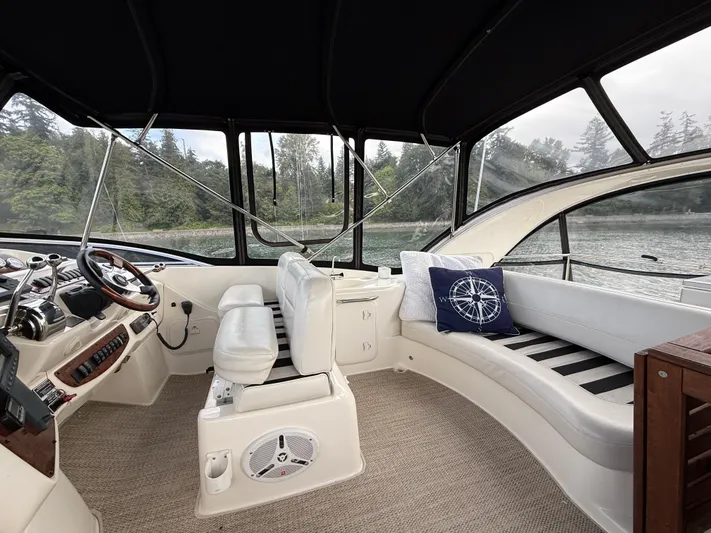 Diamonds Wild Yacht Photos Pics Interior of 2006 Meridian 411 Sedan yacht with helm and seating area.