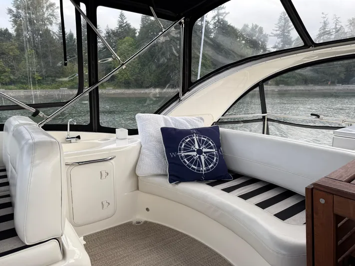 Diamonds Wild Yacht Photos Pics Interior of 2006 Meridian 411 Sedan yacht with plush seating and nautical-themed decor.