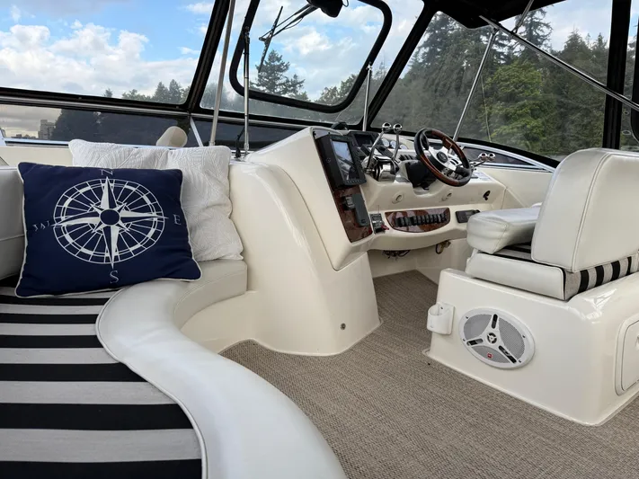 Diamonds Wild Yacht Photos Pics Interior of a 2006 Meridian 411 Sedan yacht with plush seating and nautical decor.