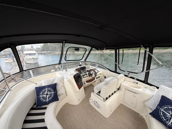 Diamonds Wild Yacht Photos Pics Luxurious 2006 Meridian 411 Sedan yacht interior with plush seating and elegant helm.