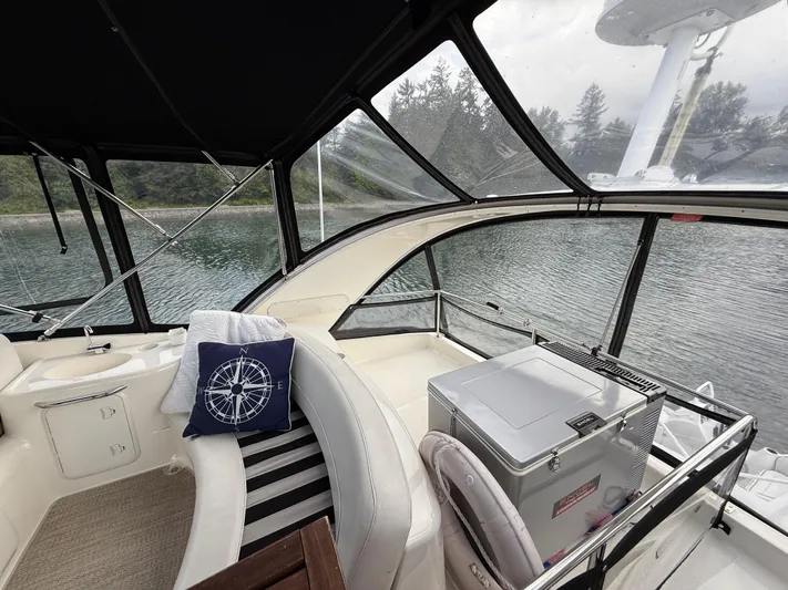 Diamonds Wild Yacht Photos Pics Interior of 2006 Meridian 411 Sedan yacht with seating and scenic water view.