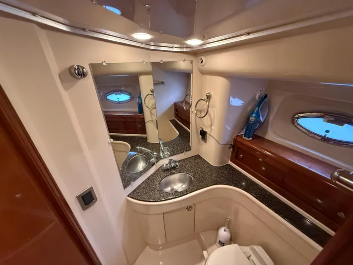 Diamonds Wild Yacht Photos Pics Luxurious bathroom in 2006 Meridian 411 Sedan yacht with modern fixtures and elegant design.