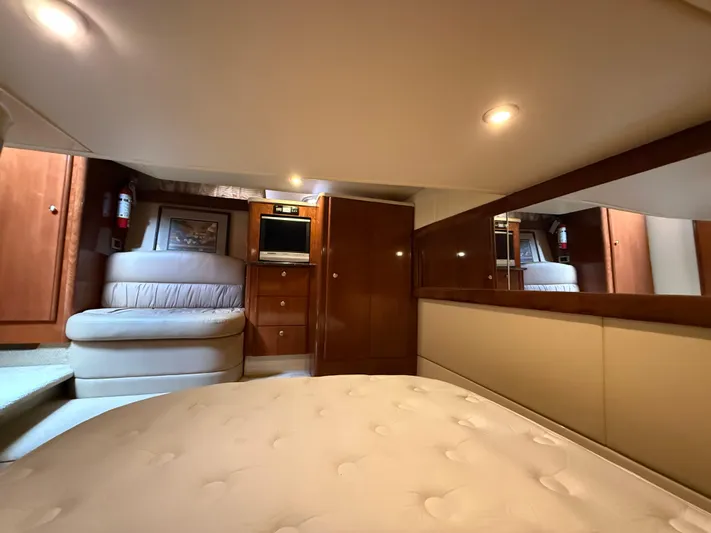 Diamonds Wild Yacht Photos Pics Luxurious interior of 2006 Meridian 411 Sedan yacht with cozy seating and TV.