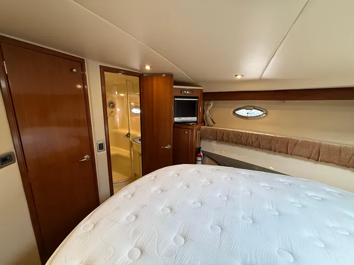 Diamonds Wild Yacht Photos Pics Interior of 2006 Meridian 411 Sedan yacht with bed, bathroom, and TV.