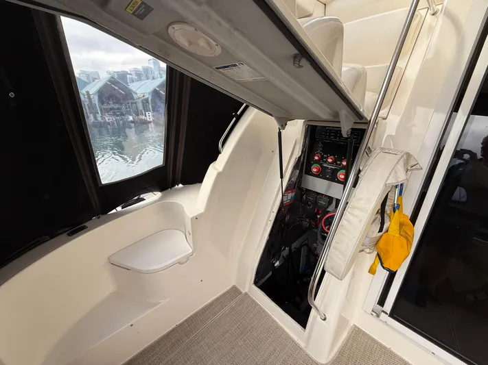 Diamonds Wild Yacht Photos Pics Interior view of a 2006 Meridian 411 Sedan yacht with control panel and safety equipment.